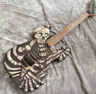 Skull Carving Body 6 Strings Electric Guitar in Matte Black Color